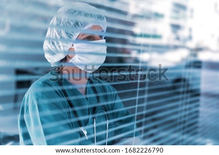 Doctor is looking away with, worry, frustration, tiredness and exhausting deep feelings. Stock photo © 