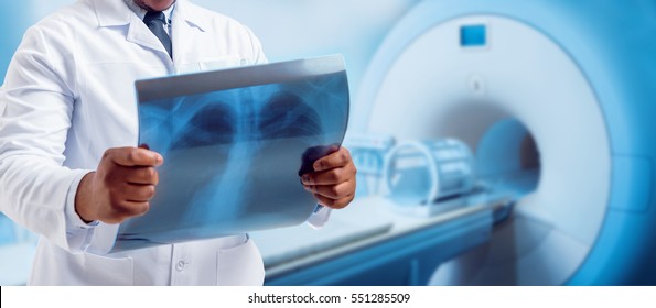 Doctor looking MRI picture. Medical equipment.