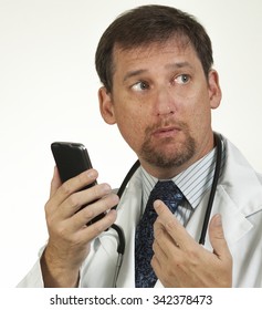 Doctor Looking Over His Shoulder While Looking At His Hand Held Tablet