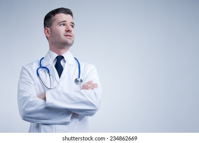 Doctor Looking Up Thinking Or Worried About Something Coming Up With The Future