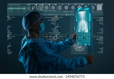 Doctor looking at total hip replacement X-ray film room at the hospital, healthcare concept.  Doctor check up x-ray film of the brain by ct scan brain at patient's room hospital. healthy concept.