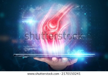 The doctor looks at a hologram of a sore knee, severe pain. X-ray image, trauma, rheumatologist consultation, skeletal image, medical concept, medical technologies of the future, pain when walking