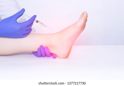 The Doctor Makes An Injection Into The Ankle Joint Of The Patient In Plasma Therapy To Eliminate Inflammation And Pain, Relieve Edema, Copy Space