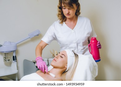 Doctor Makes The Patient Cryotherapy Procedure - Cryomassage - Cold Treatment. Beauty Clinic. Woman Doing Face Skin Cryo Oxygen Treatment.