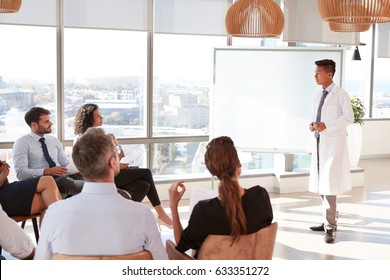 Doctor Making Presentation To Medical Staff In Hospital - Powered by Shutterstock