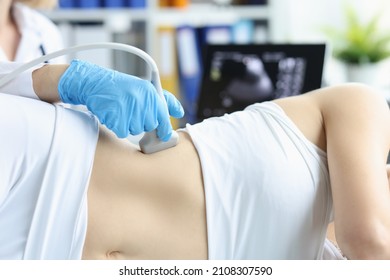 Doctor making ultrasound of kidneys to patient in clinic closeup - Shutterstock ID 2108307590