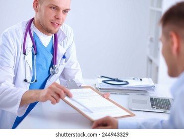 Doctor Male Giving Patient Folder With  Paper In Her Office, Isolated