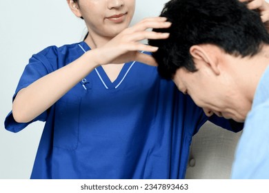 A doctor and a male patient who diagnose thinning hair treatment
