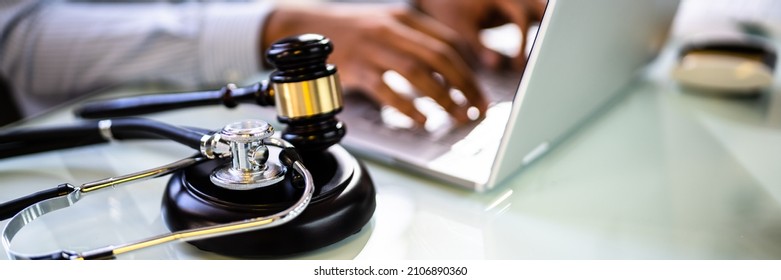 Doctor Malpractice Court. Law Gavel And Stethoscope In Courtroom