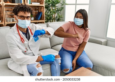 Doctor Man And Patient Woman Bump Elbow As A Protection Covid-19 Handshake.