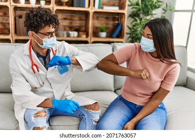 Doctor Man And Patient Woman Bump Elbow As A Protection Covid-19 Handshake.