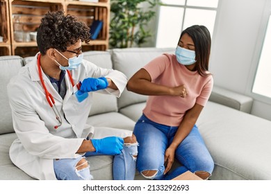 Doctor Man And Patient Woman Bump Elbow As A Protection Covid-19 Handshake.