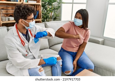 Doctor Man And Patient Woman Bump Elbow As A Protection Covid-19 Handshake.