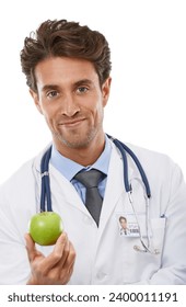 Doctor, man and portrait in studio with apple and advice in healthcare for health diet in medicine. Nutritionist, face and fruit for wellness in vitamins, care and natural food by white background