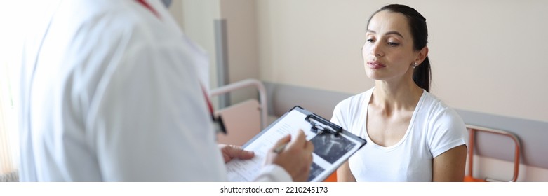 Doctor In Mask Communicates With Patient In Clinic . Ultrasound And Medical Diagnosis Concept