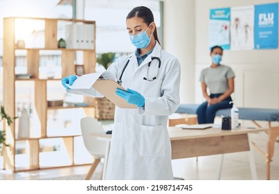 Doctor With Mask And Patient For Medical Test Results Documents At Hospital In Covid Or Corona Global Pandemic. Consulting Healthcare Woman Worker With Health Insurance Paperwork Of Sick Girl