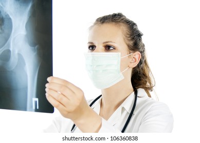 Doctor In A Mask With An X-ray Photograph