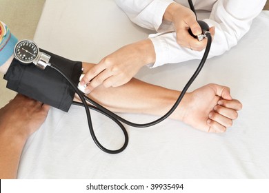 The doctor measures pressure in the patient