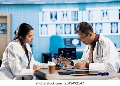 Doctor measuring patient glucose levels with glucometer during diabetes check up. Healthcare professional provides diagnostics and advice on managing hypoglycemia and hyperglycemia in the office. - Powered by Shutterstock