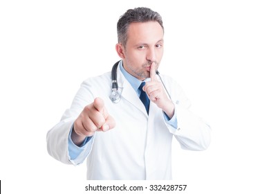 Doctor Or Medic Making Silence And Quiet Gesture With Finger On Lips As Privacy And Confidentiality Concept Of Medical Profession