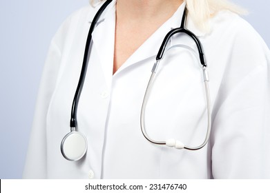 The Doctor In The Medical Apron With Stethoscope