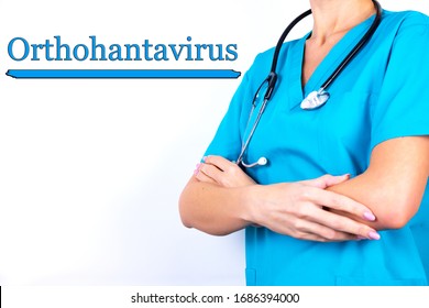 Doctor In Medical Clothes On A Light Background With The Text Orthohantavirus. Medical Concept.