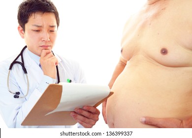 Doctor With A Medical Examination In Obese Patient