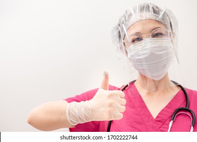 Doctor Medical Gesture Up Confidence Let The Patient For Outbreak COVID-19 Epidemic Virus Outbreak Concept . Medical Staff In Face Shield And Medical Mask For Prevention Of Coronavirus Pandemic .