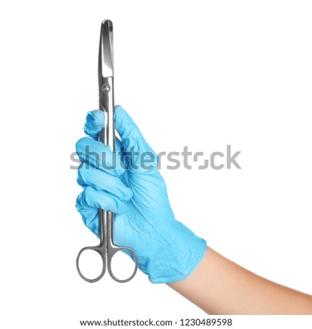 Doctor in medical glove holding surgical scissors on white background