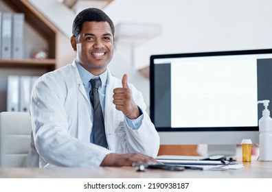 Doctor, Medical Practitioner And Healthcare Worker Showing Thumbs Up For FDA Or Drug Approval In A Hospital With Blank Screen Copy Space On A Computer. GP Pleased With Clinic Success In His Office