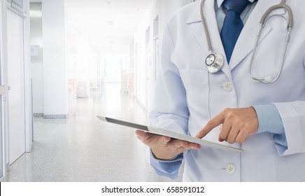 Doctor or medical students using digital tablet at hospital ward. Medical technology internet concept. - Shutterstock ID 658591012