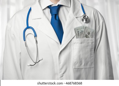 Doctor With Money In Coat Pocket Closeup