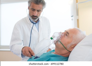 doctor monitoring the patients progress - Shutterstock ID 699112780