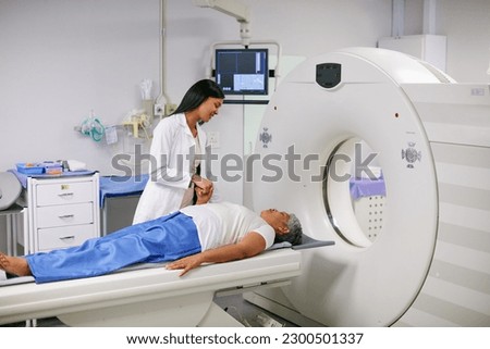Doctor, mri and woman holding hands of patient in hospital before scanning in machine. Ct scan, comfort and medical professional with senior female person in radiology test for healthcare in clinic.
