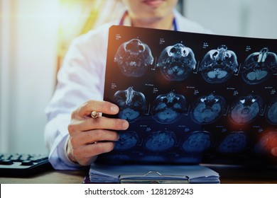 Doctor With MRI (Xray) Brain Scans 