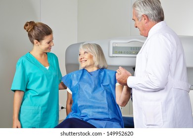 Doctor and MTA helping senior woman in radiology at bone density measurement