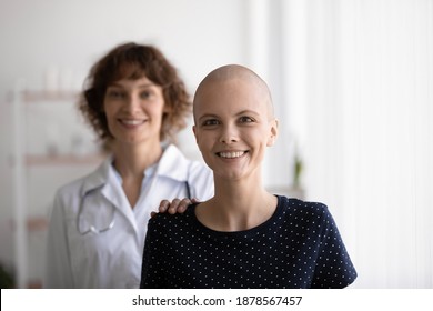 Doctor Is My Guardian Angel. Happy Woman Patient Recovering From Cancer And Smiling Female Oncologist Stand Behind Look At Camera. Physician Support Sick Young Lady On Way To Health. Headshot Portrait