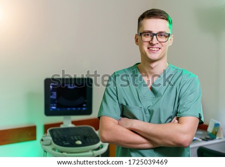 Doctor near ultrasound equipment. Diagnostics. Sonography. Portrait. Closeup