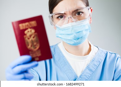 Doctor or nurse at airport customs security check holding a passport, no entry quarantine and isolation order ban, COVID-19 virus disease epidemic, viral Coronavirus global worldwide pandemic outbreak - Shutterstock ID 1682499271