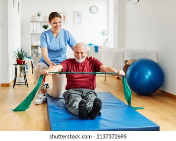 Doctor or nurse caregiver exercise with senior man at clinic or nursing home - Powered by Shutterstock