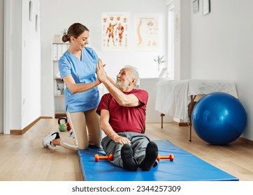 Doctor or nurse caregiver exercise with senior man at clinic or nursing home - Powered by Shutterstock