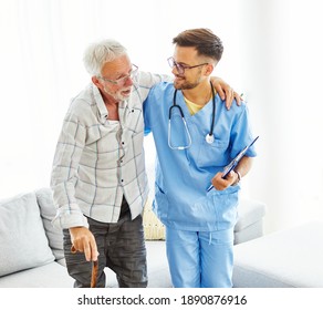 Doctor or nurse caregiver helping senior man with a walking cane stick at home or nursing home
