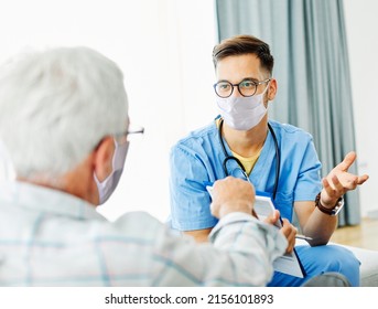 Doctor or nurse caregiver helping senior man  at home or nursing home