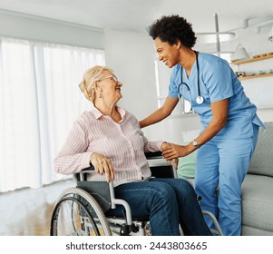 Doctor or nurse caregiver helping  senior woman in a wheelchair at home or nursing home, woman with chronic health condition, person with disability - Powered by Shutterstock