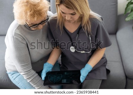 Similar – Female doctor showing an x-ray on the tablet