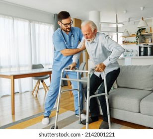 Doctor or nurse caregiver with senior man using walker assistanece  at home or nursing home - Shutterstock ID 2142001221
