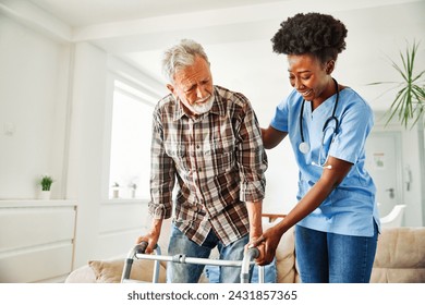 Doctor or nurse caregiver with senior man using walker assistanece  at home or nursing home - Powered by Shutterstock