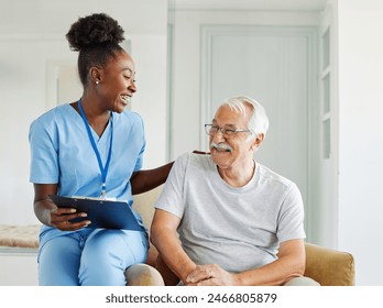 Doctor or nurse caregiver with senior man talking and having fun at home or nursing home - Powered by Shutterstock