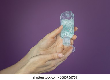 Doctor nurse cleaning and sanitizing or desinfecting hands with hand sanitizer or soup because of Coronavrius Covid-19 - Powered by Shutterstock