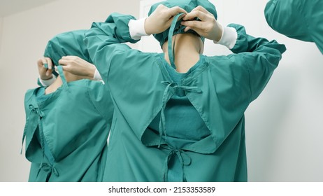 Doctor or nurse is dressed in a uniform for surgery in operating room